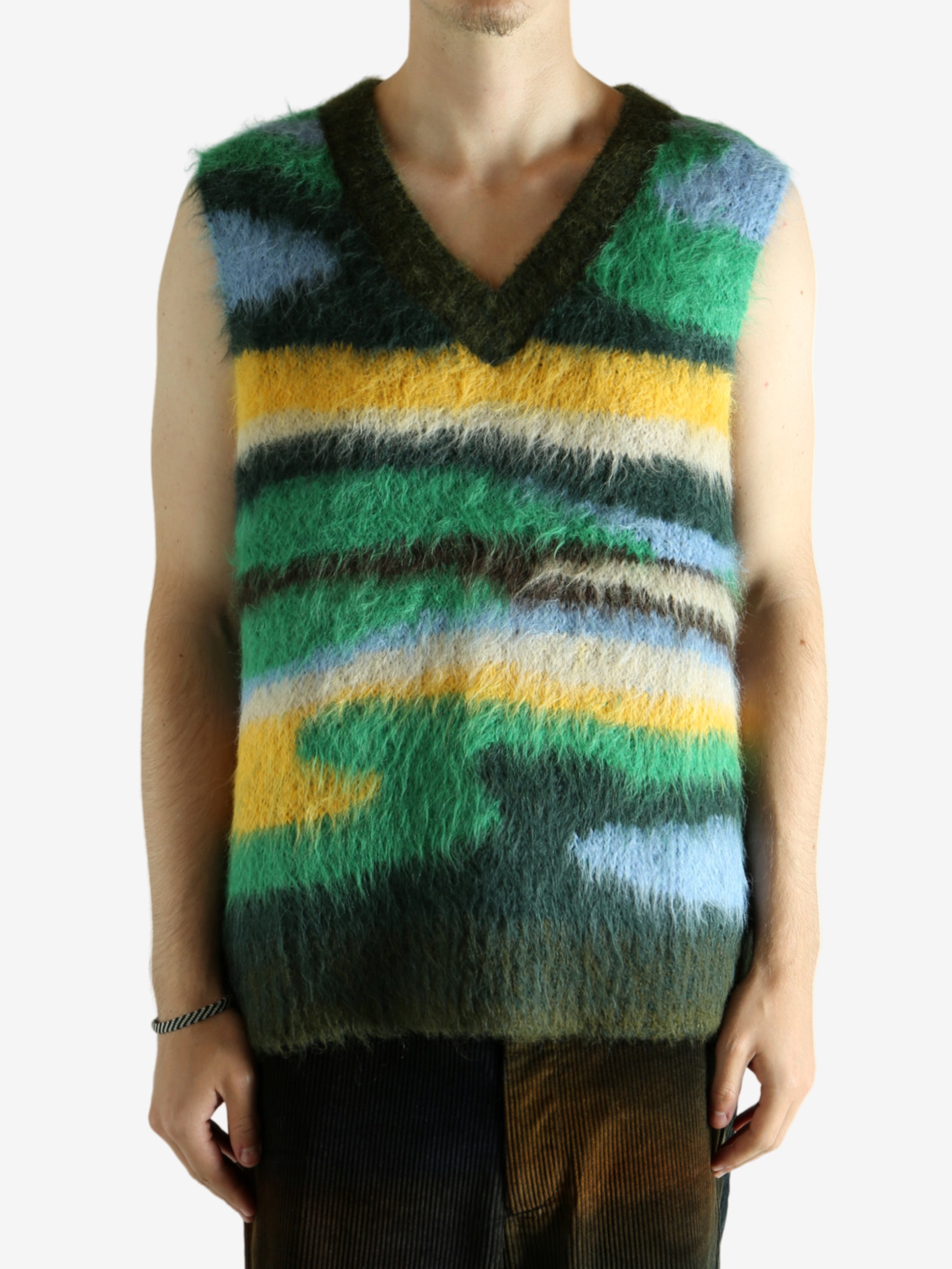 Green vest worn by a person, showing the vest's fit