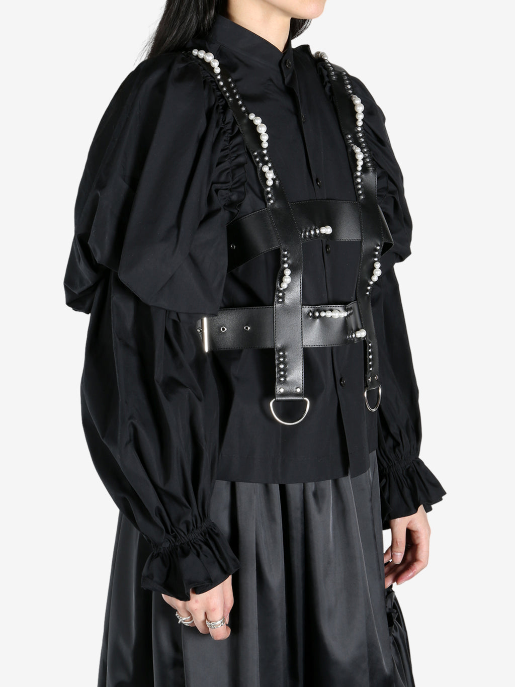 Black top worn by a person, showing the top's fit