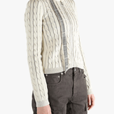 White knit long sleeve worn by a person, showing the loose fit.