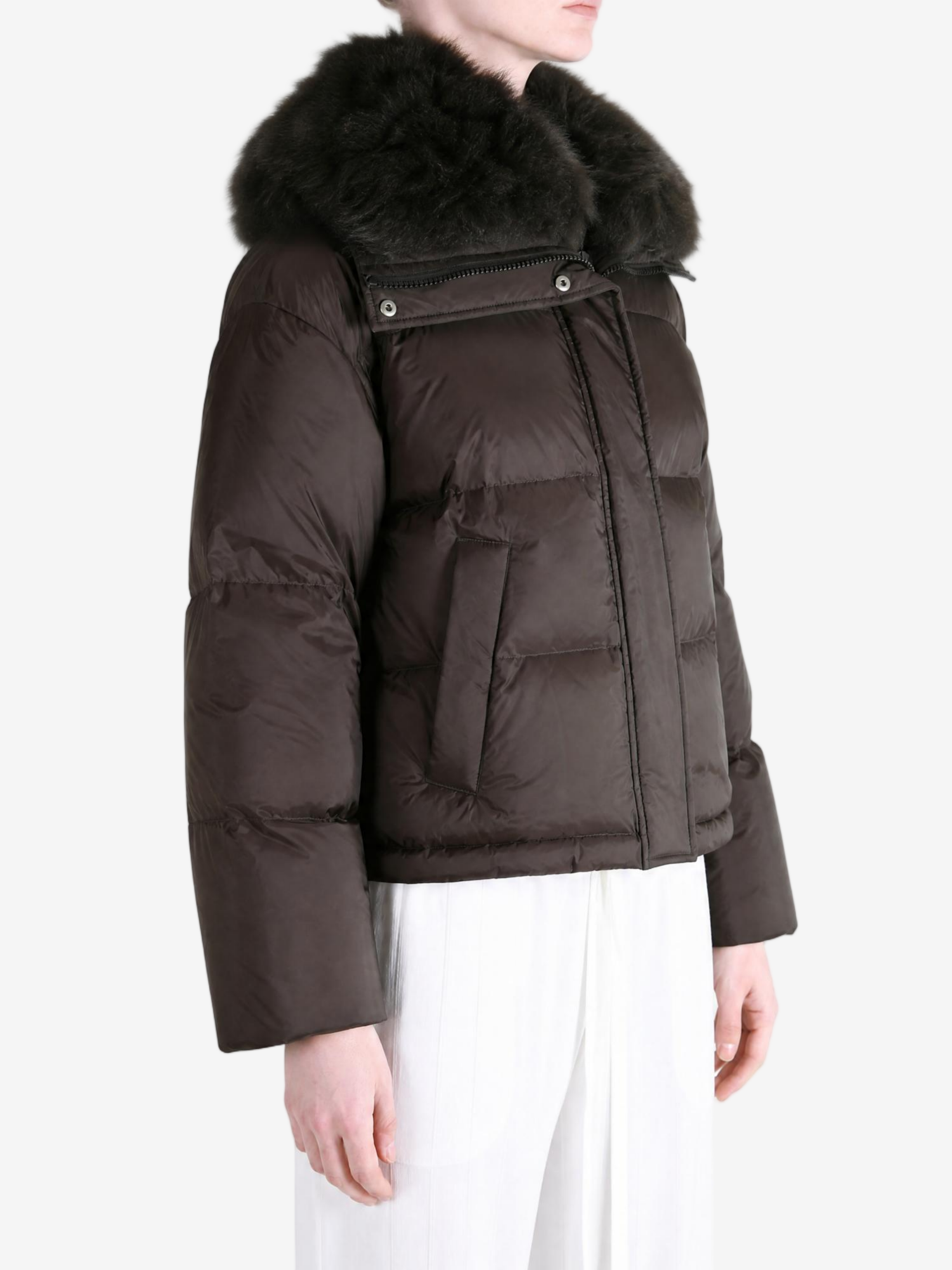 Brown jacket worn by a person, showing the jacket fit
