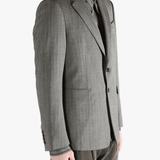 Grey jacket worn by a person, showing the jacket's fit