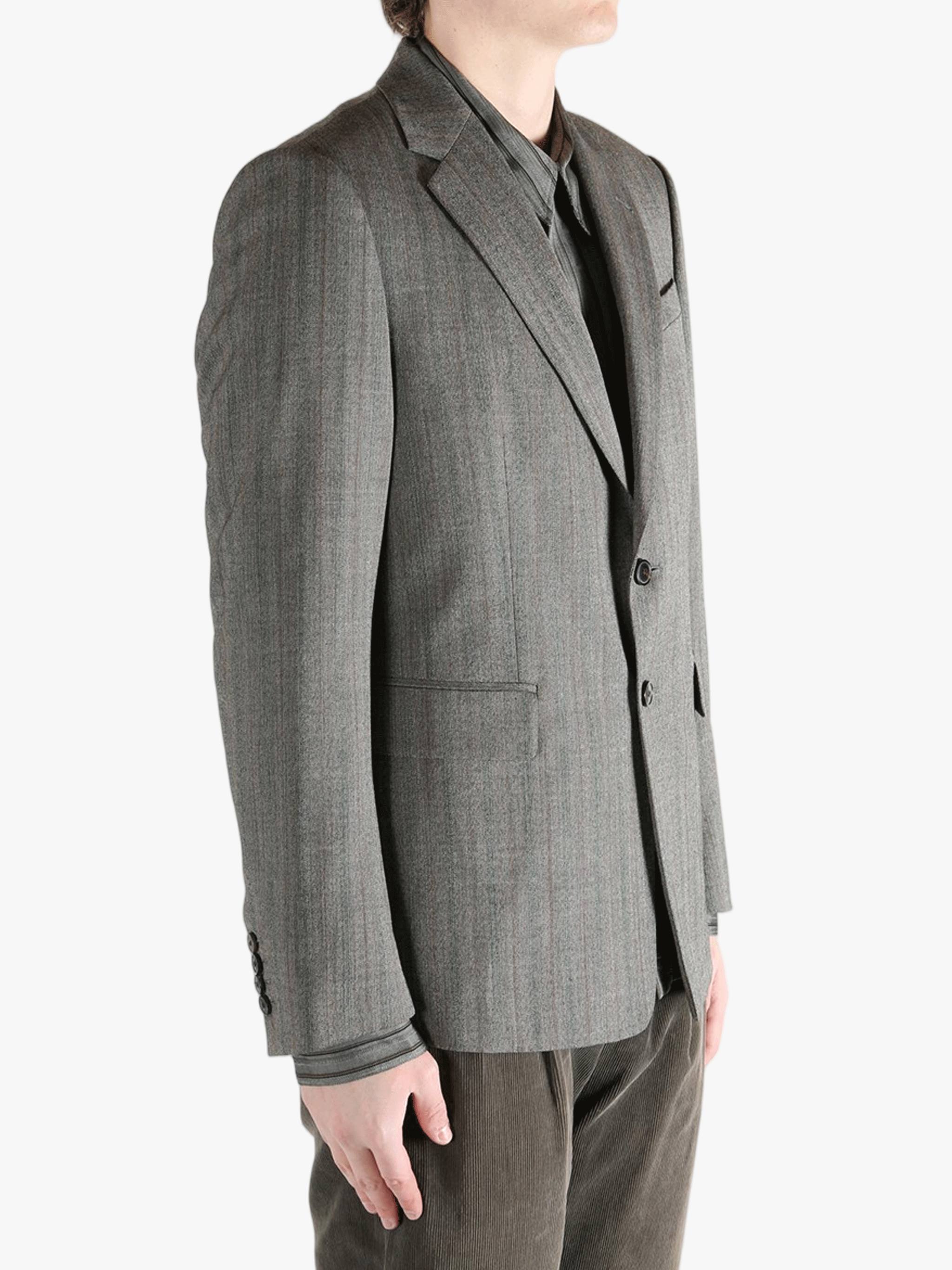 Grey jacket worn by a person, showing the jacket's fit
