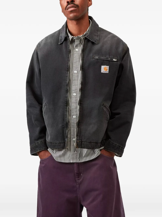 black jackets-coats worn by a person, showing the jackets-coats fit