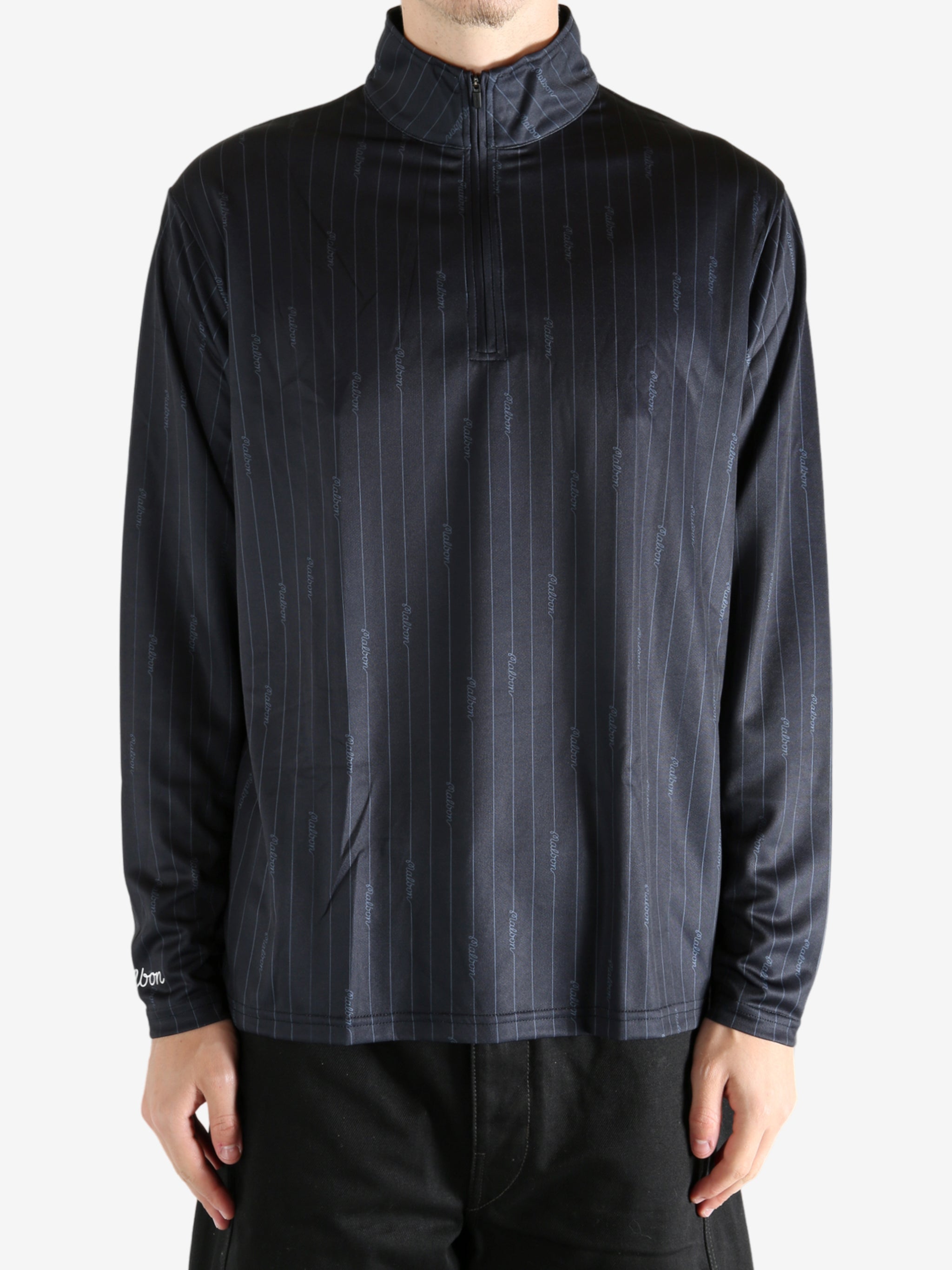 Black pullover worn by a person, showing the pullover's fit