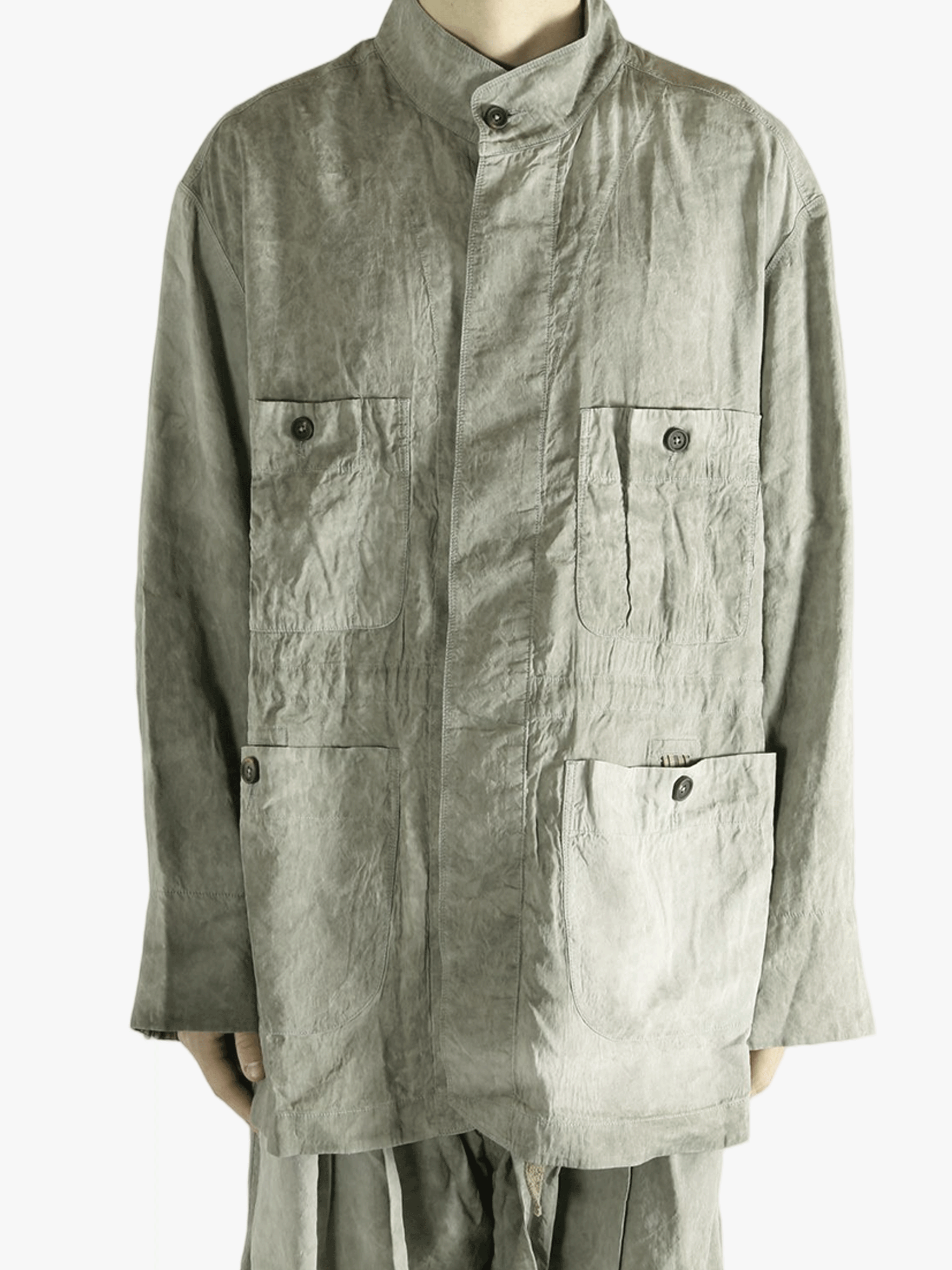 Green jacket worn by a person, showing jacket's fit