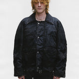 Black jacket worn by a person, showing the jacket's fit