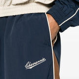 Navy pants worn by a person, showing the pants fit