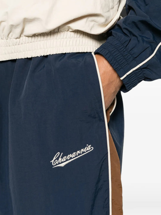 Navy pants worn by a person, showing the pants fit