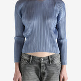 Blue top worn by a person, showing the top's fit