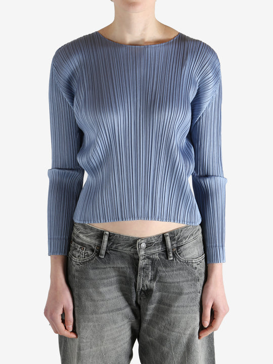 Blue top worn by a person, showing the top's fit