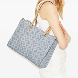 Blue bag worn by a person, showing the bag's fit