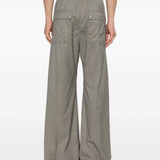 Grey pant worn by a person, showing the pant's fit