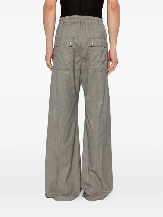 Grey pant worn by a person, showing the pant's fit