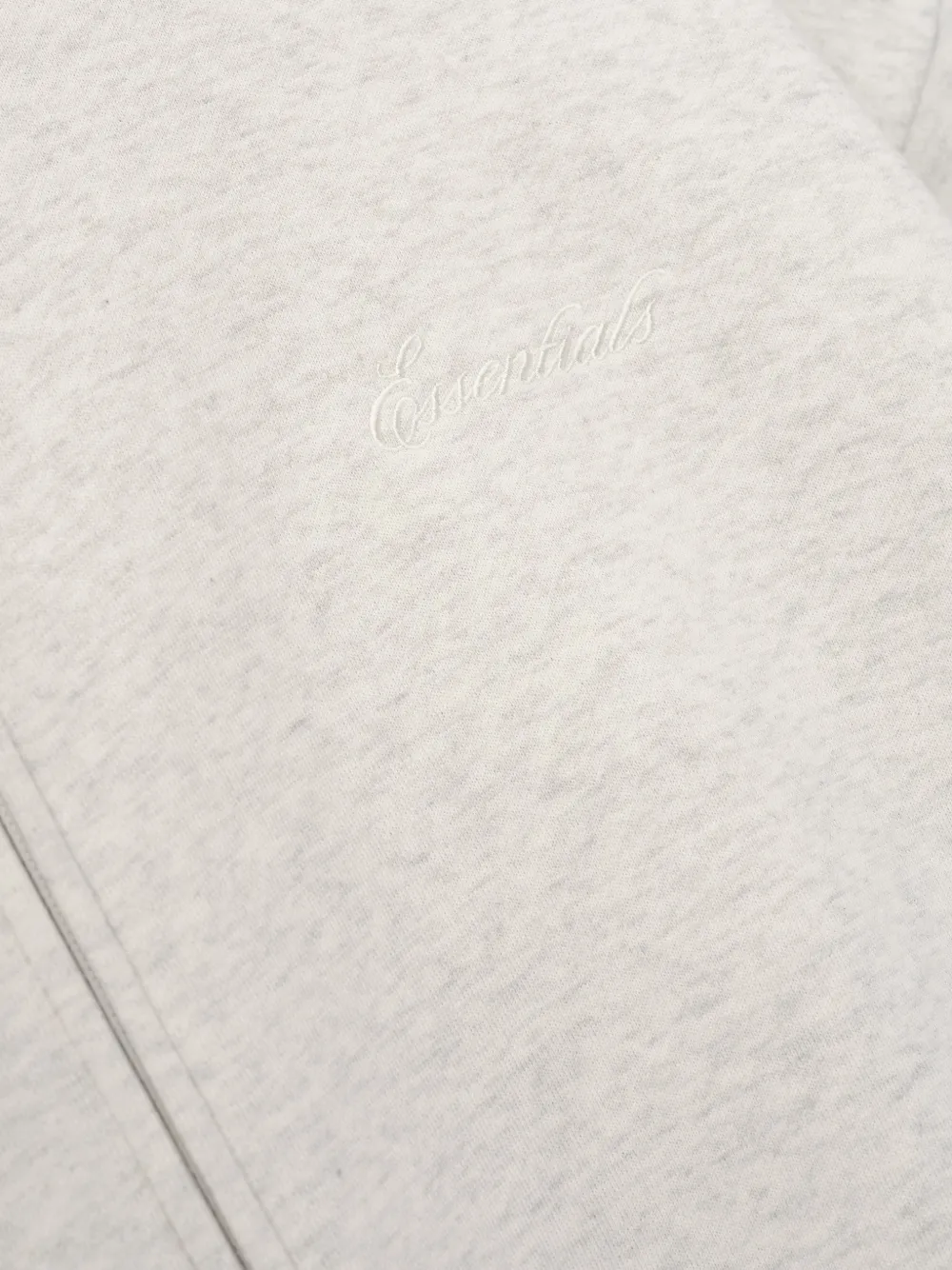 Close up of white hoodie, showing texture of the Cotton and Polyester fabric