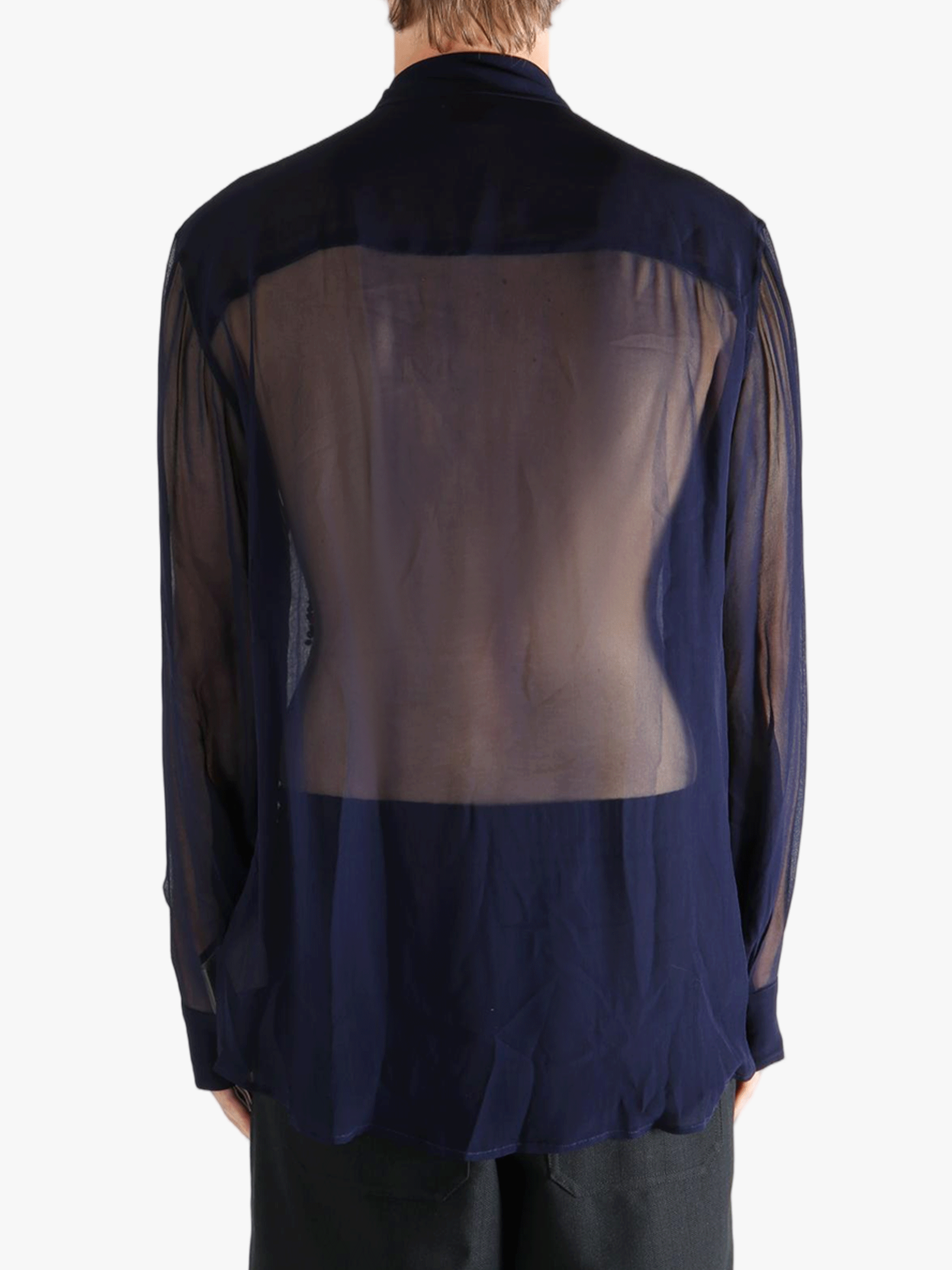 Navy blue shirt worn by a person, showing the shirt's fit