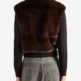 Brown sweater worn by a person, showing the sweater's fit