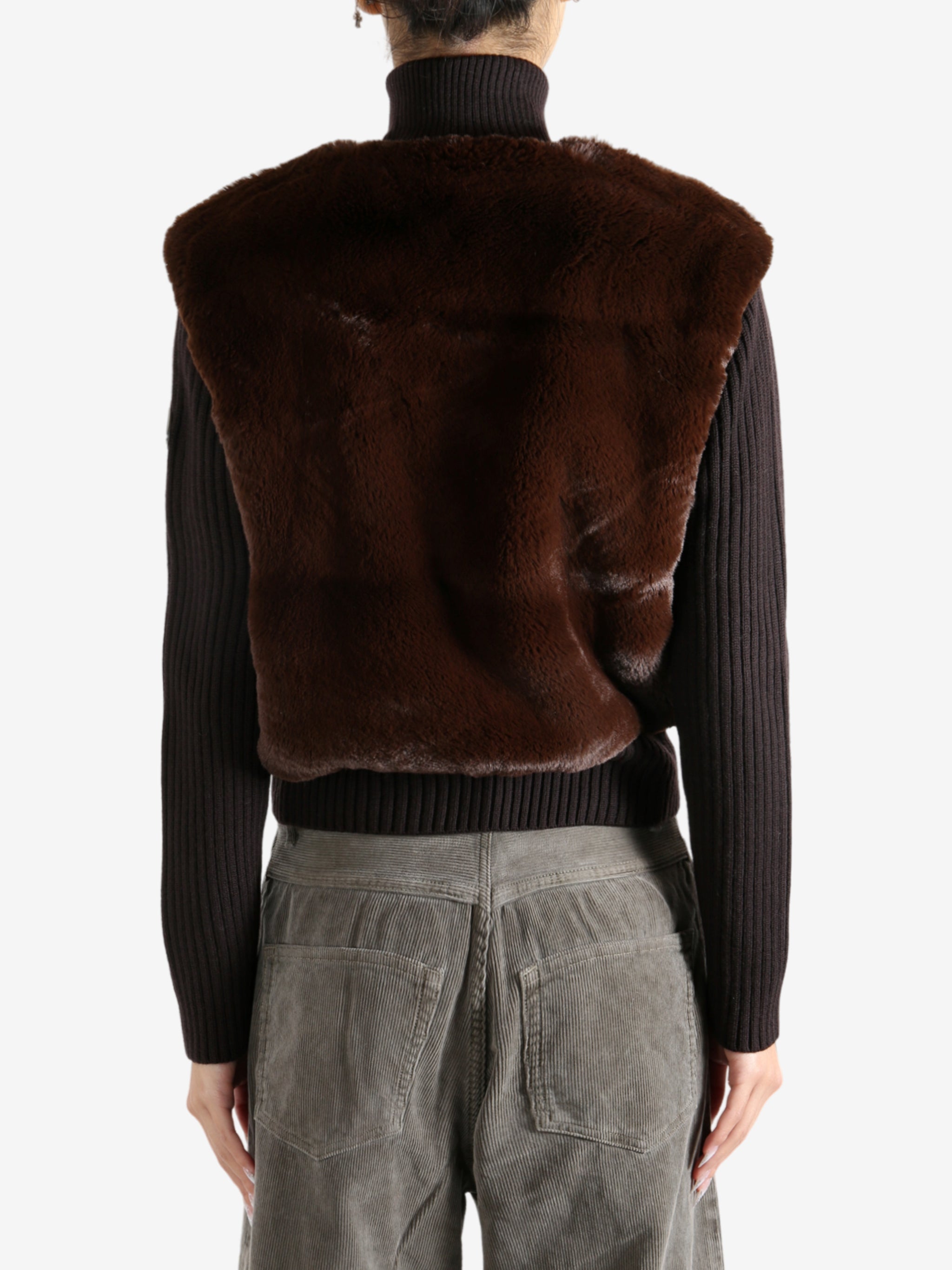 Brown sweater worn by a person, showing the sweater's fit