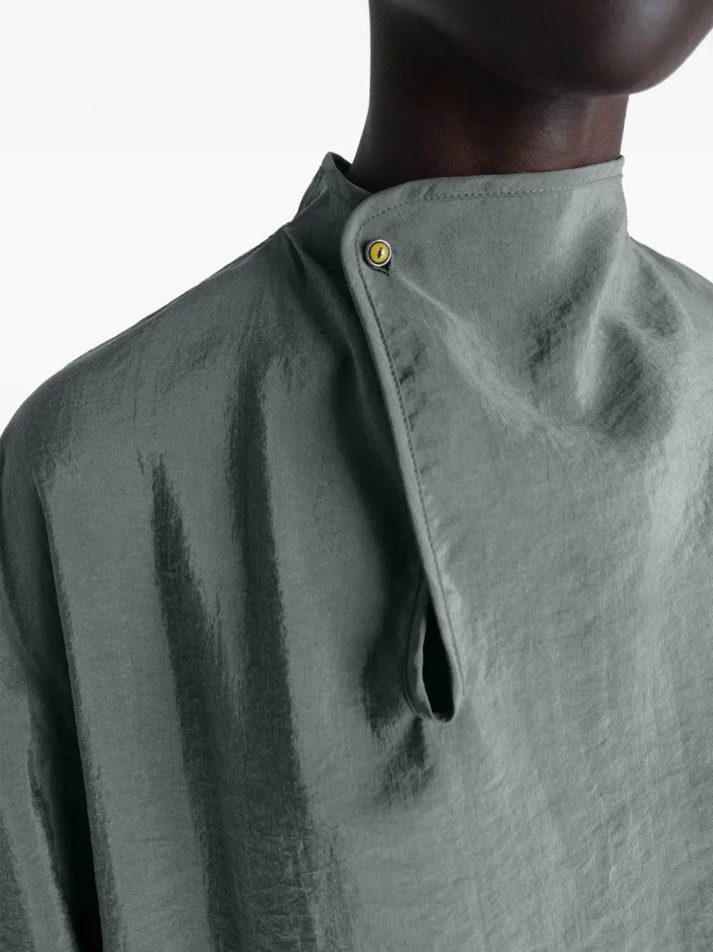 Close up of the grey top, showing texture of the silk fabric