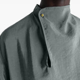 Close up of the grey top, showing texture of the silk fabric