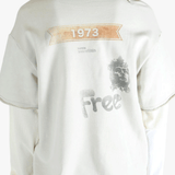 White shirt worn by a person, showing the shirt's fit