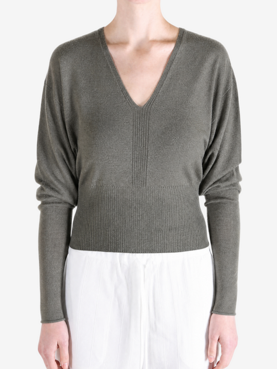 Grey top worn by a person, showing the top fit