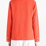 Orange jacket worn by a person, showing the jacket fit
