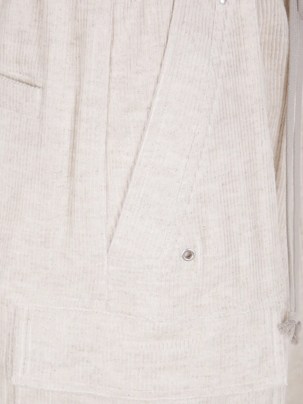 Close up of tan pants, showing texture of the cotton fabric