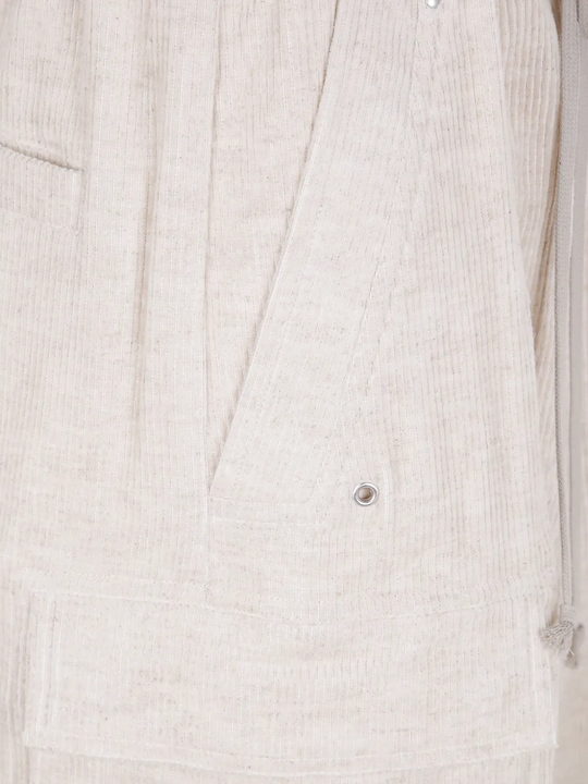 Close up of tan pants, showing texture of the cotton fabric