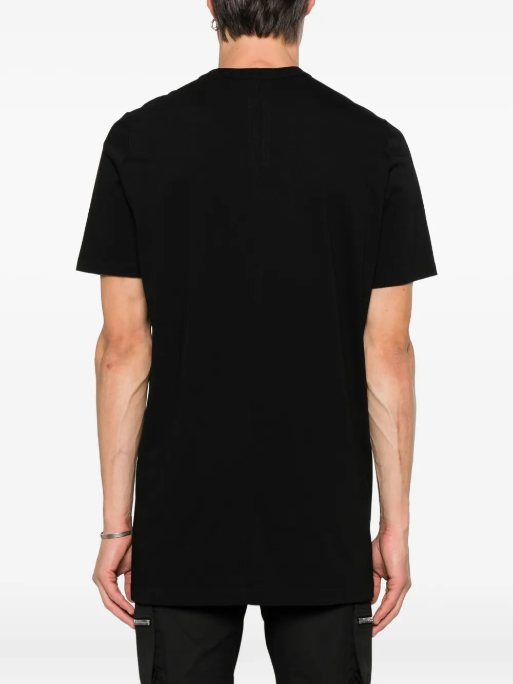Black t-shirt worn by a person, showing the t-shirt's fit