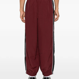 Burgundy pants, full body view