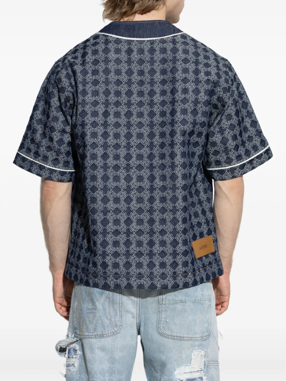 Blue shirt worn by a person, showing the shirt's fit