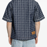 Blue shirt worn by a person, showing the shirt's fit