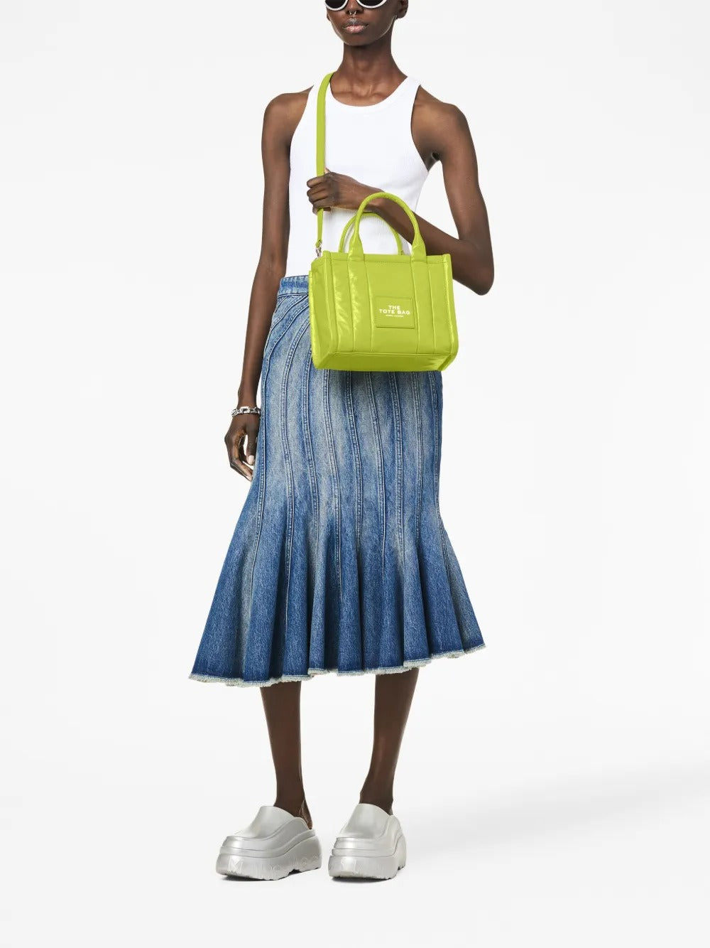 Green bag worn by a person, showing the bag's fit