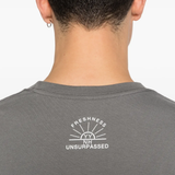 Close up of grey t-shirt, showing texture of the cotton fabric