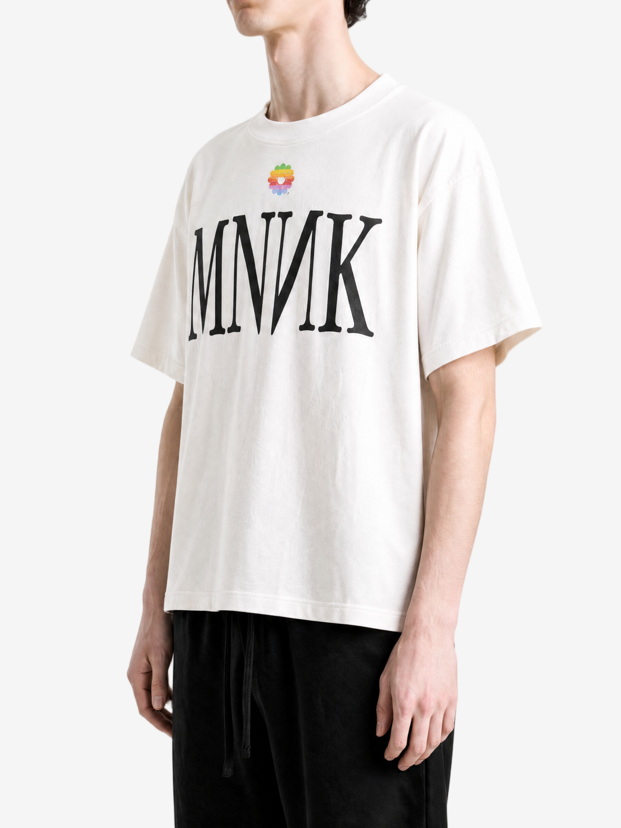 White t-shirt worn by a person, showing the t-shirt fit