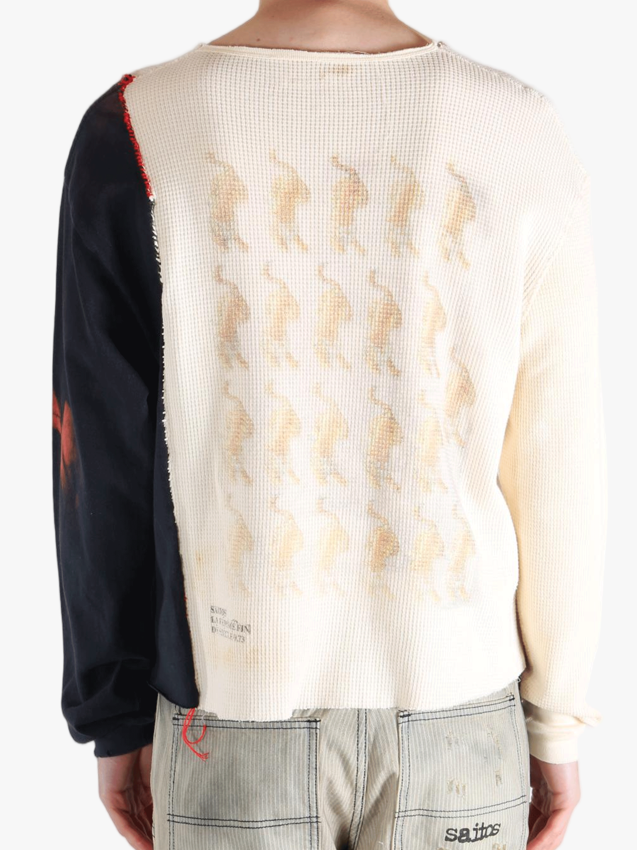 White knitwear worn by a person, showing the knitwear fit