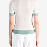 Tan shirt worn by a person, showing the shirt fit