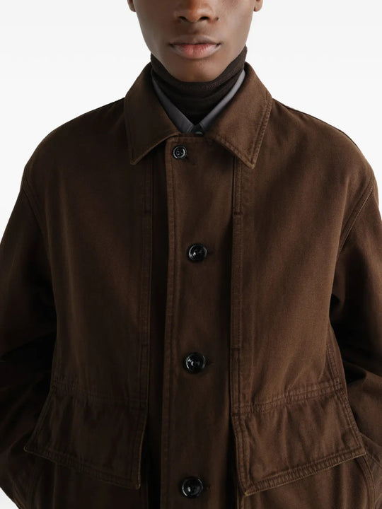 Brown jacket worn by a person, showing the jacket fit
