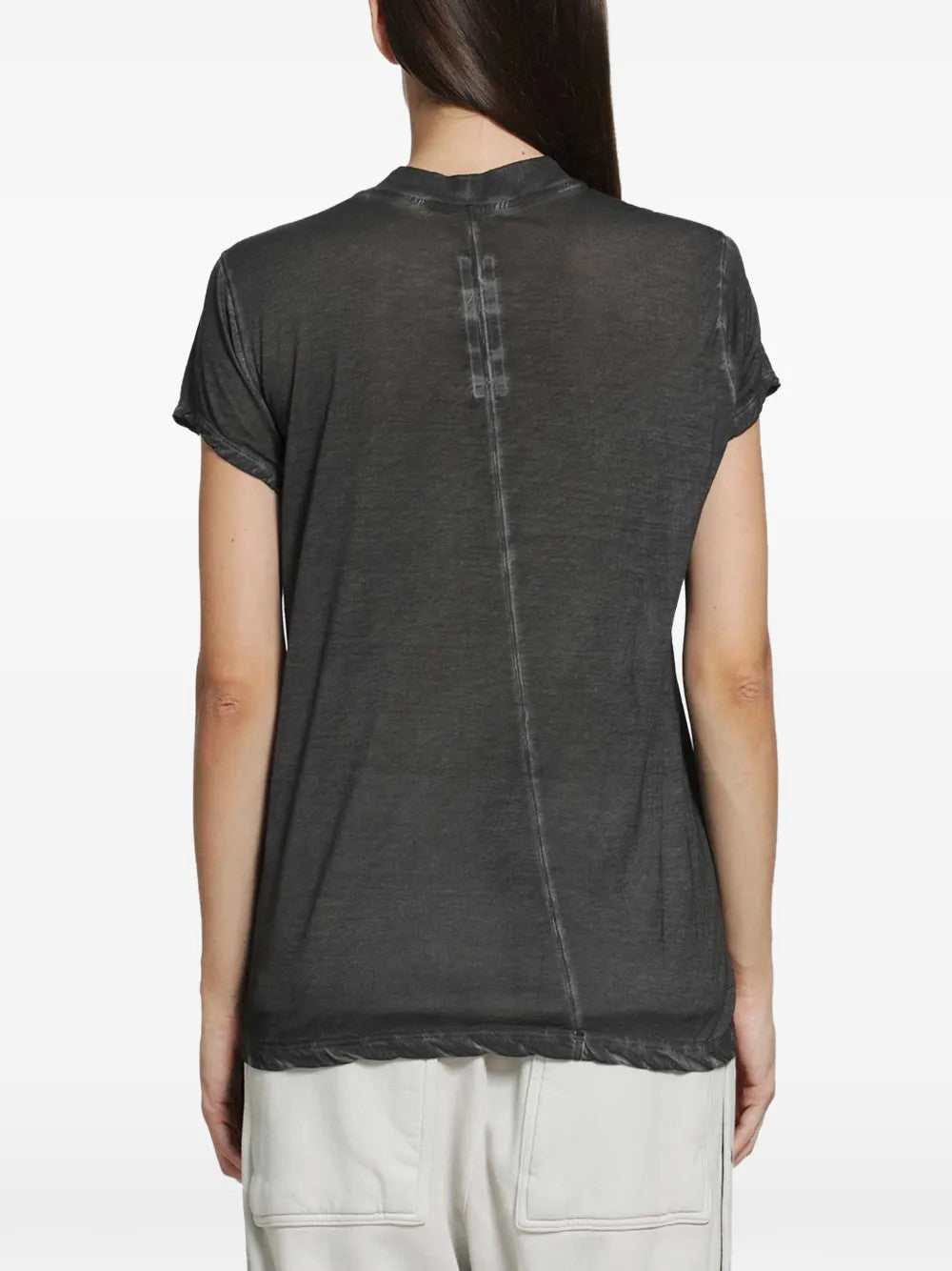 Black t-shirt worn by a person, showing the t-shirt fit
