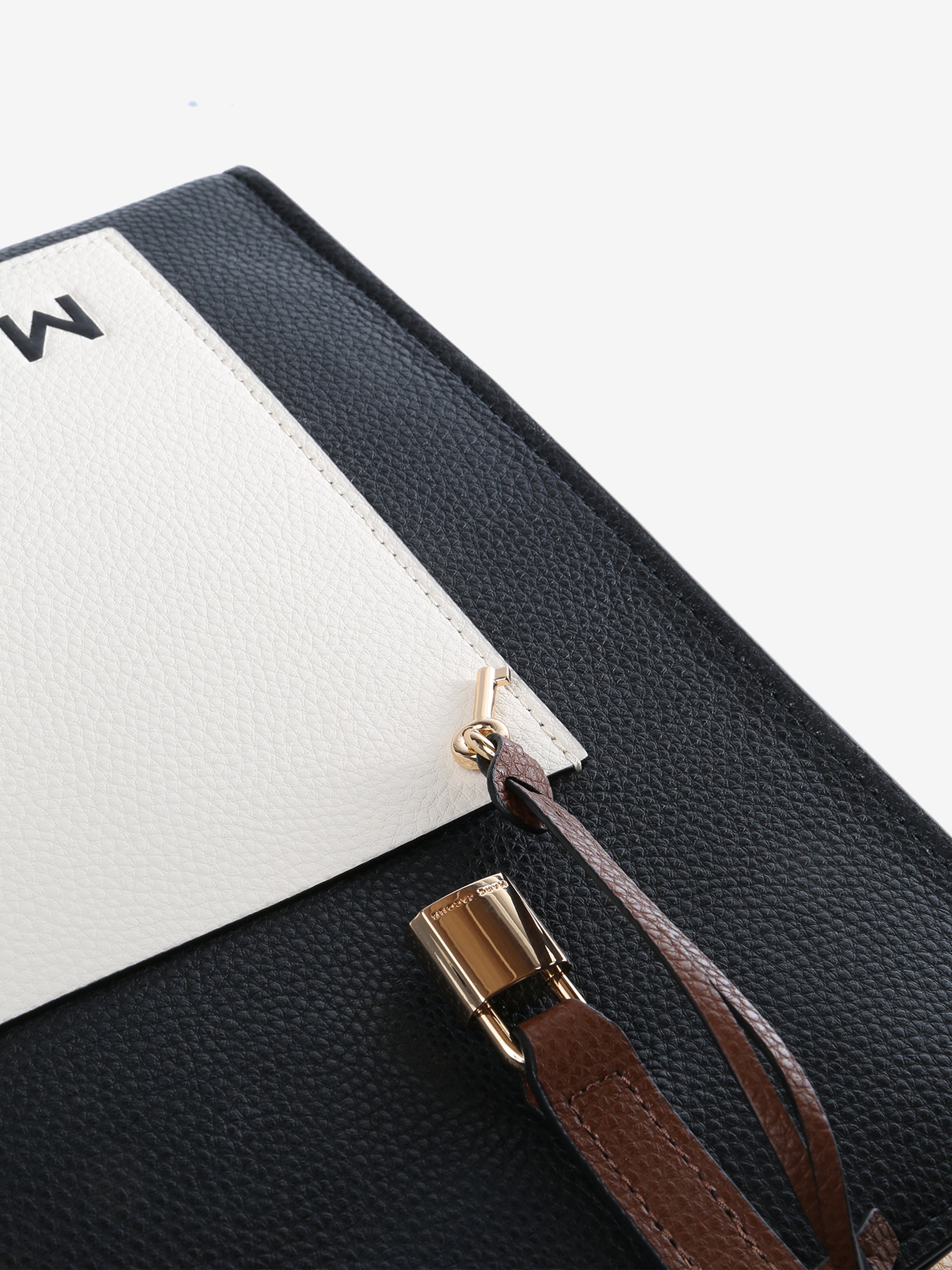 Close up of black bag, showing texture of the leather fabric