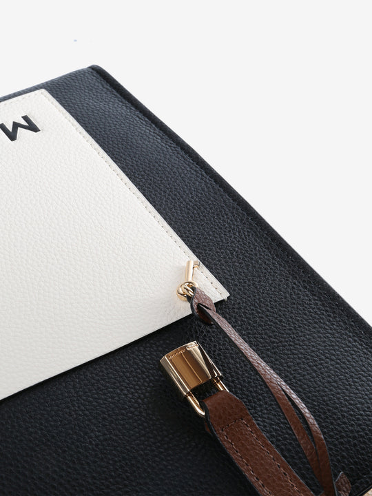 Close up of black bag, showing texture of the leather fabric