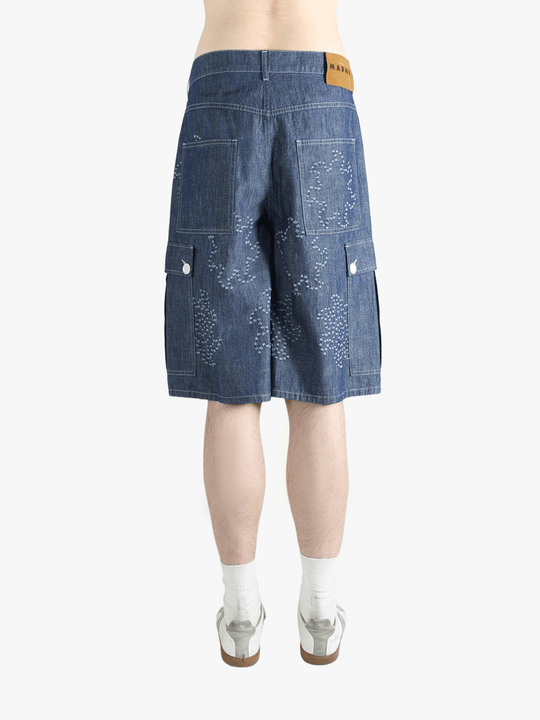 Blue shorts worn by a person, showing the shorts fit