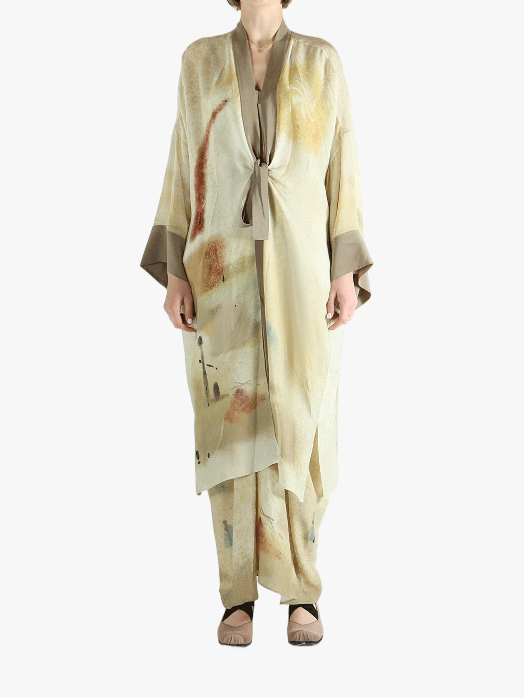 Tan top worn by a person, showing the top's fit