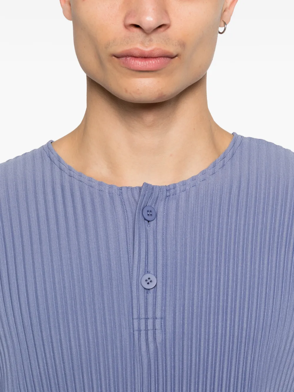 close up of blue t-shirts, showing texture of the polyester fabric