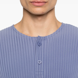 close up of blue t-shirts, showing texture of the polyester fabric
