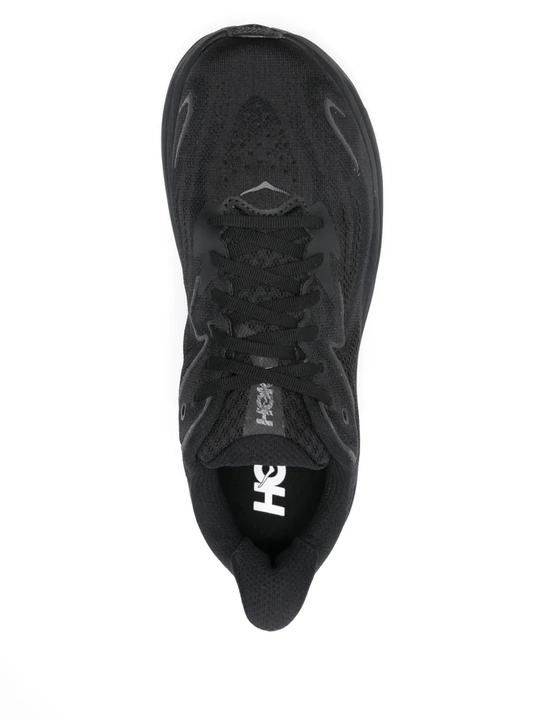 Black sneakers, vertical view