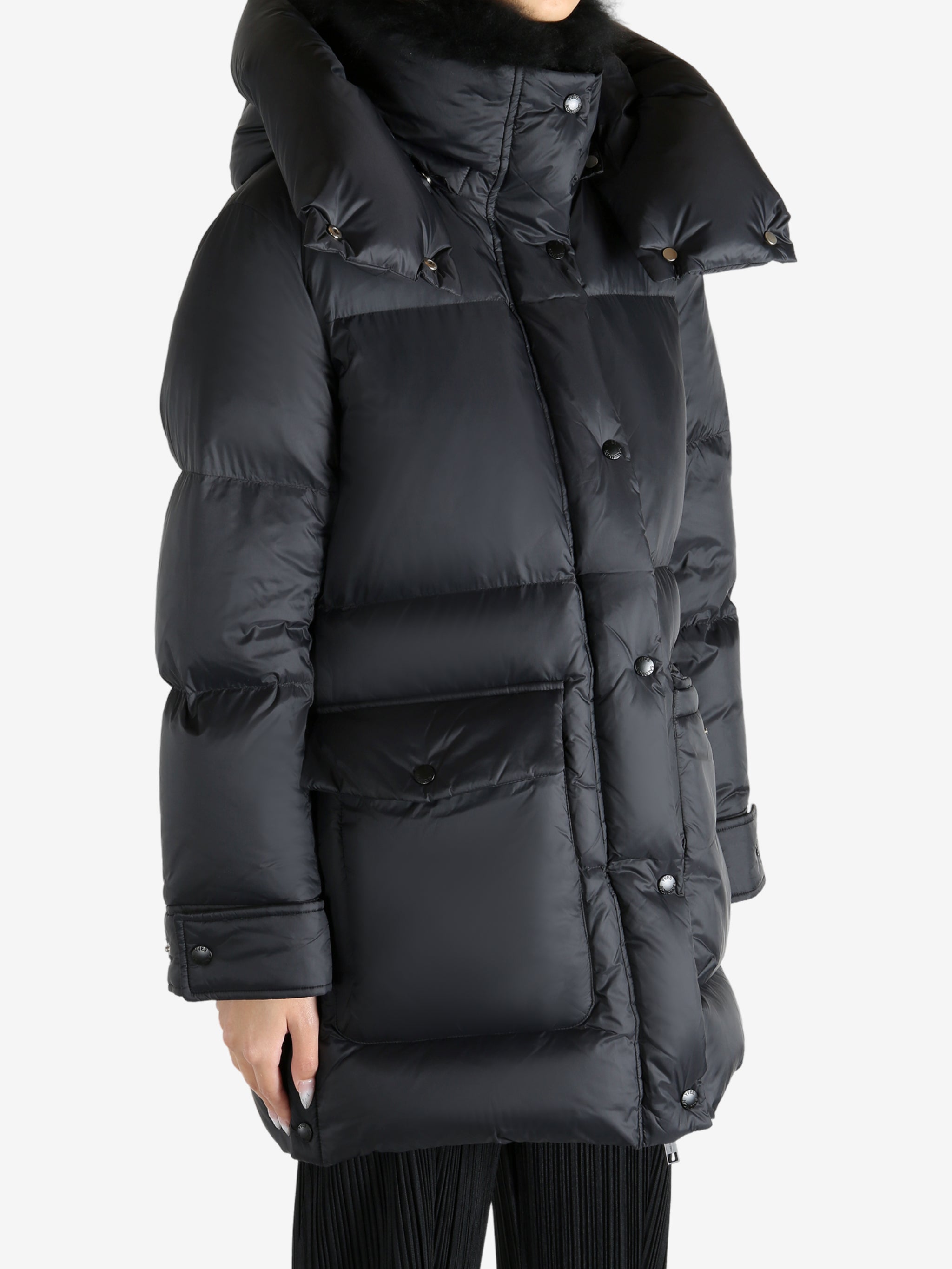 Black jacket worn by a person, showing the jacket's fit