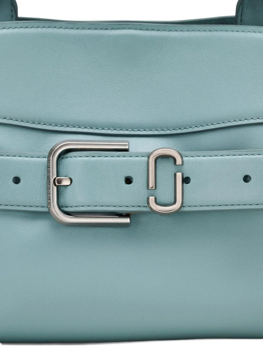 Close up of the blue bag, showing texture of the leather fabric