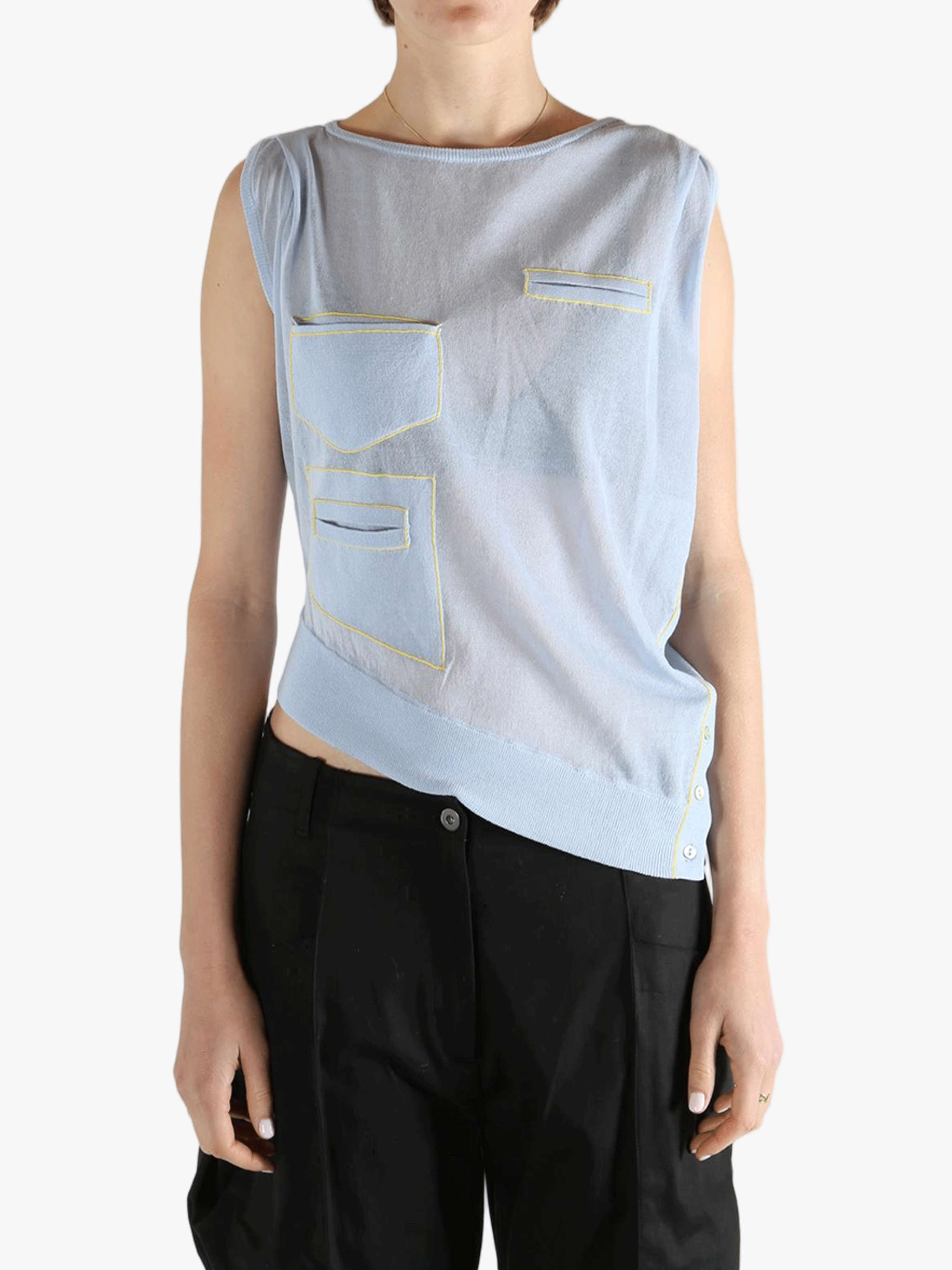 Blue vest worn by a person, showing the loose fit.