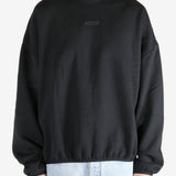  Black tops worn by a person, showing the tops fit